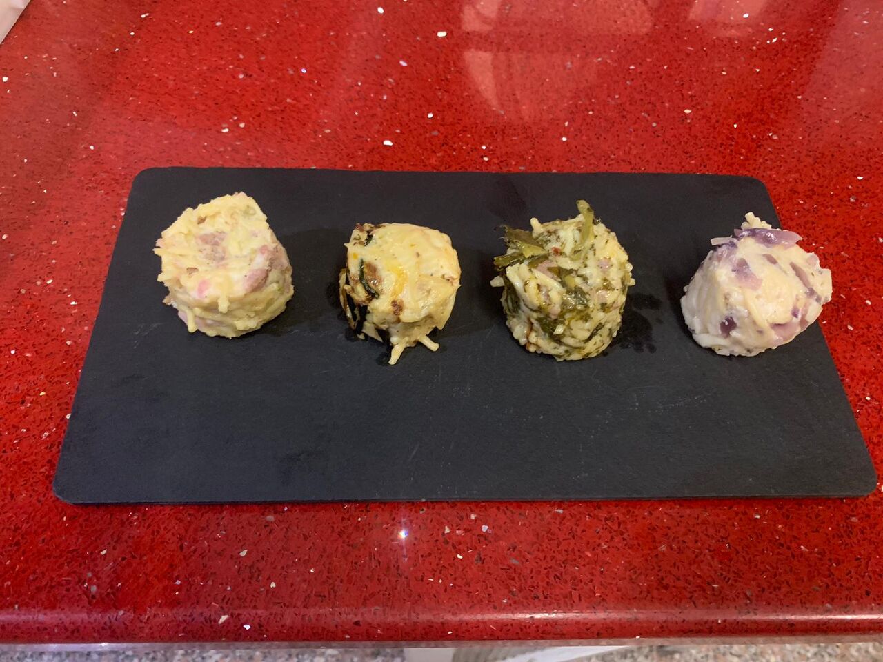 Frittatine di bucatini,prosciutto cotto e besciamella,salsiccia e friarielli,cacio e cipolla sotto cenere,parmigiana di zucchine