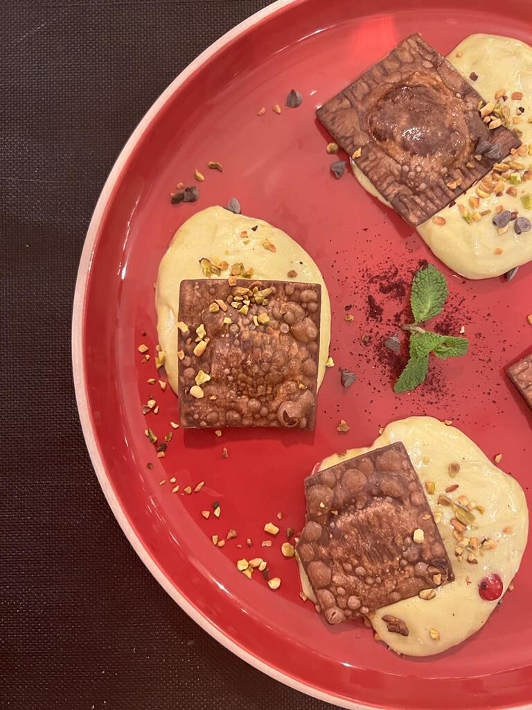 ravioli al cioccolato ripieni di arancia e ricotta