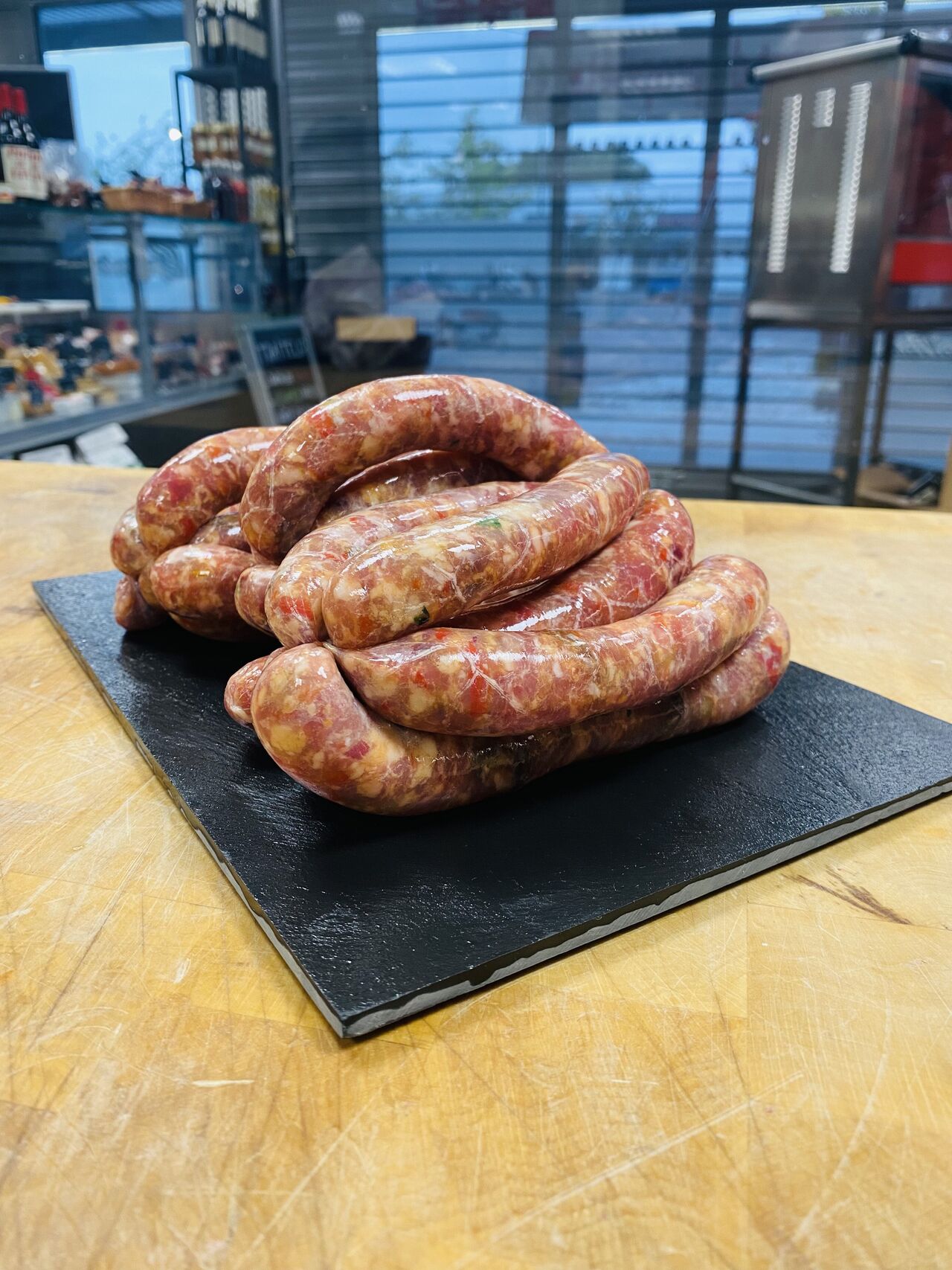 Saucisses d'agneau raisins/poivrons/cumin 