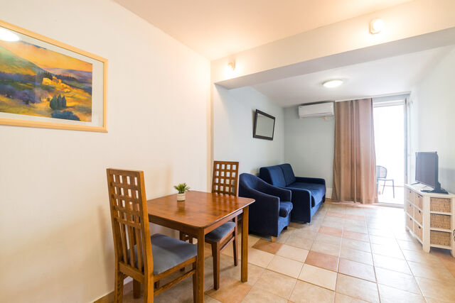 Example of living room and dining table in our apartments