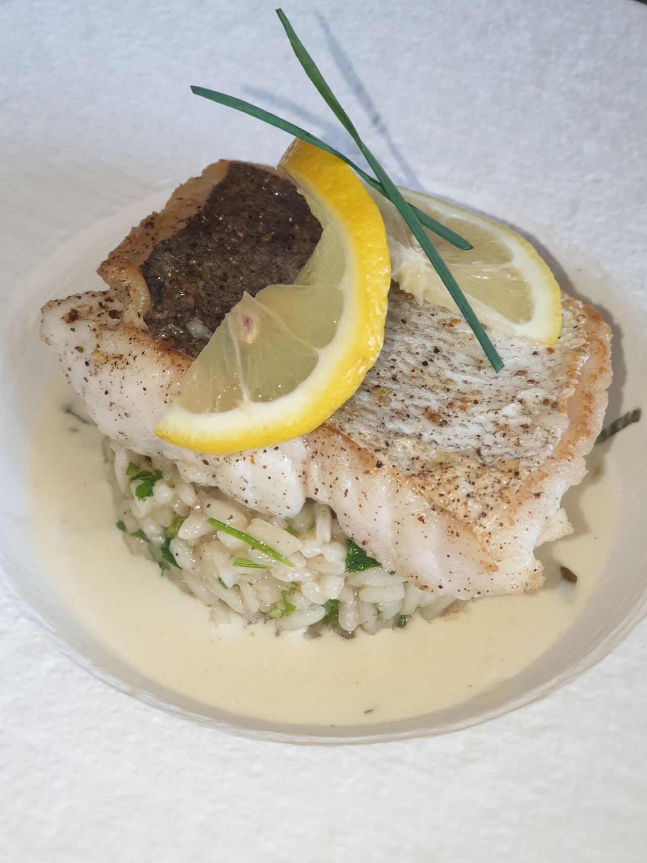 Risotto aux herbes et pavé de poisson.