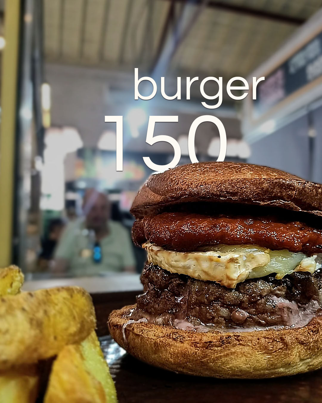Burger 150gr, queso de cabra, cebolla caramelizada, salsa chimate y pan brioche