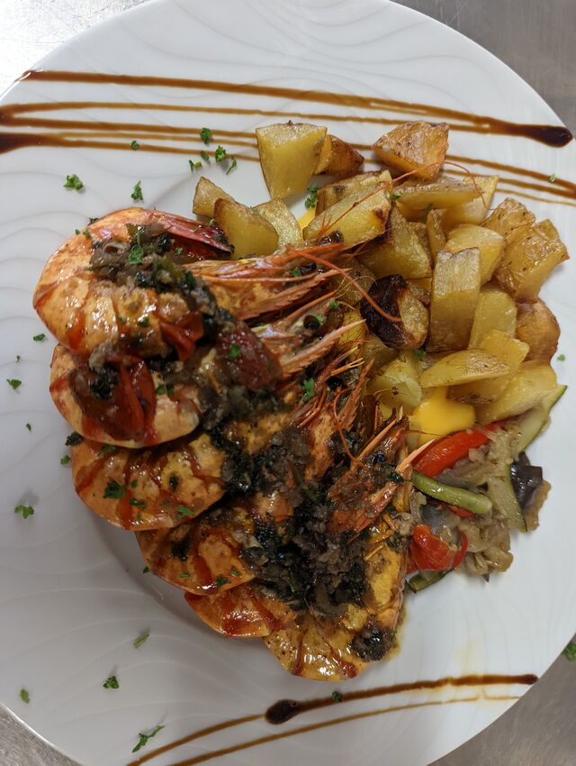 GAMBAS FLAMBEE AU GRAPPA!