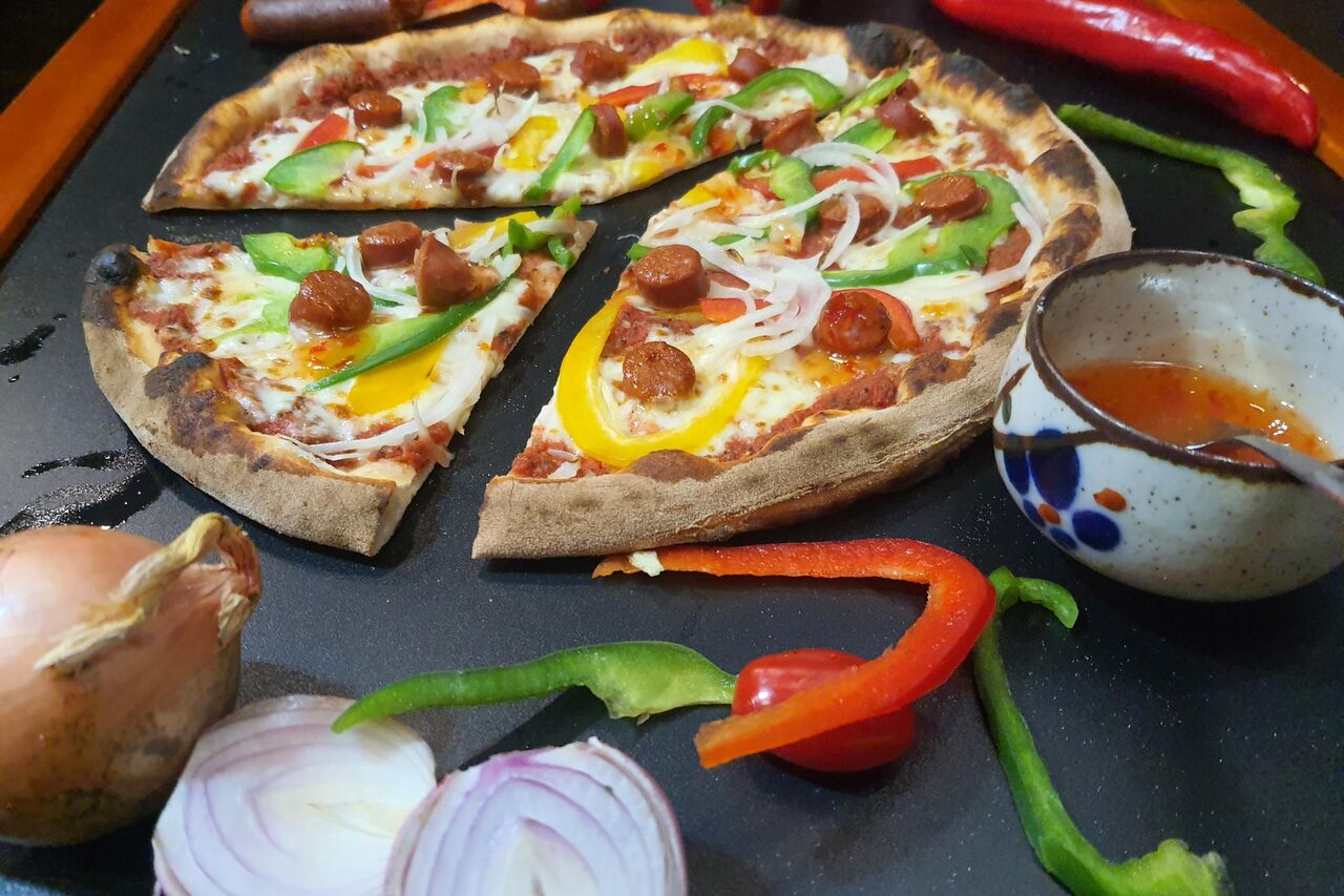 Nouvelle Pizza au Menu