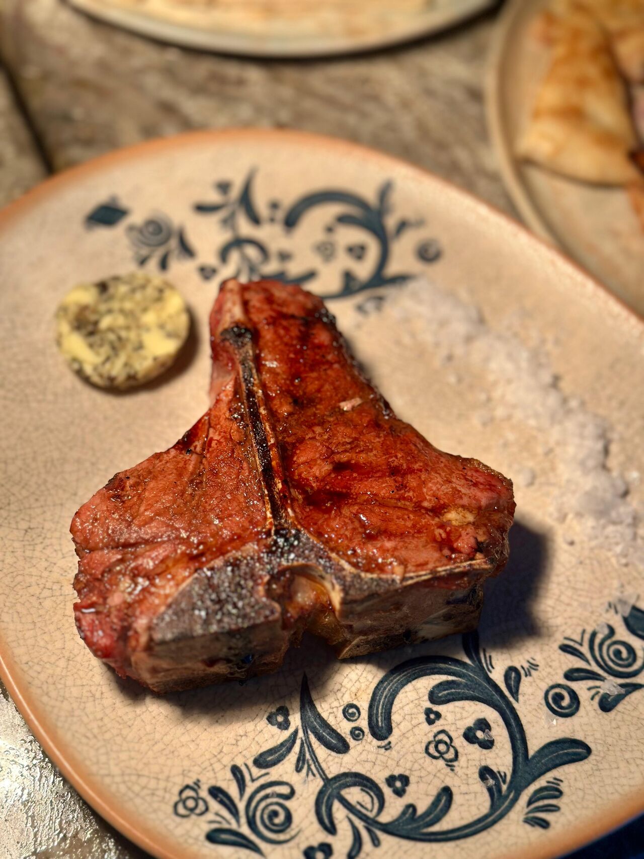 Open fire grilled lamb chops with mediteranean salad and chimichurri sauce