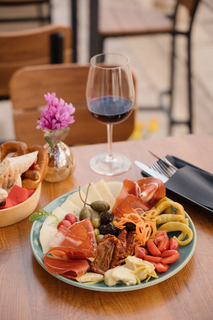 Platter with local prosciutto, cheese, dried tomatoes, capers