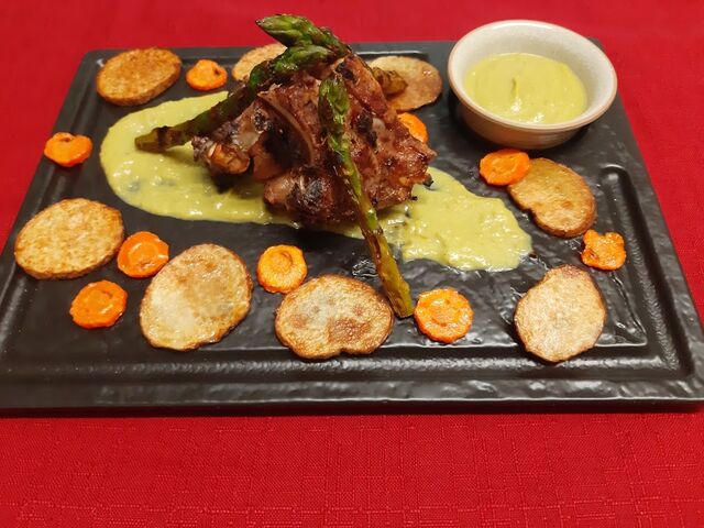Lamb grilled on lava stone in homemade Mediterranean sauce