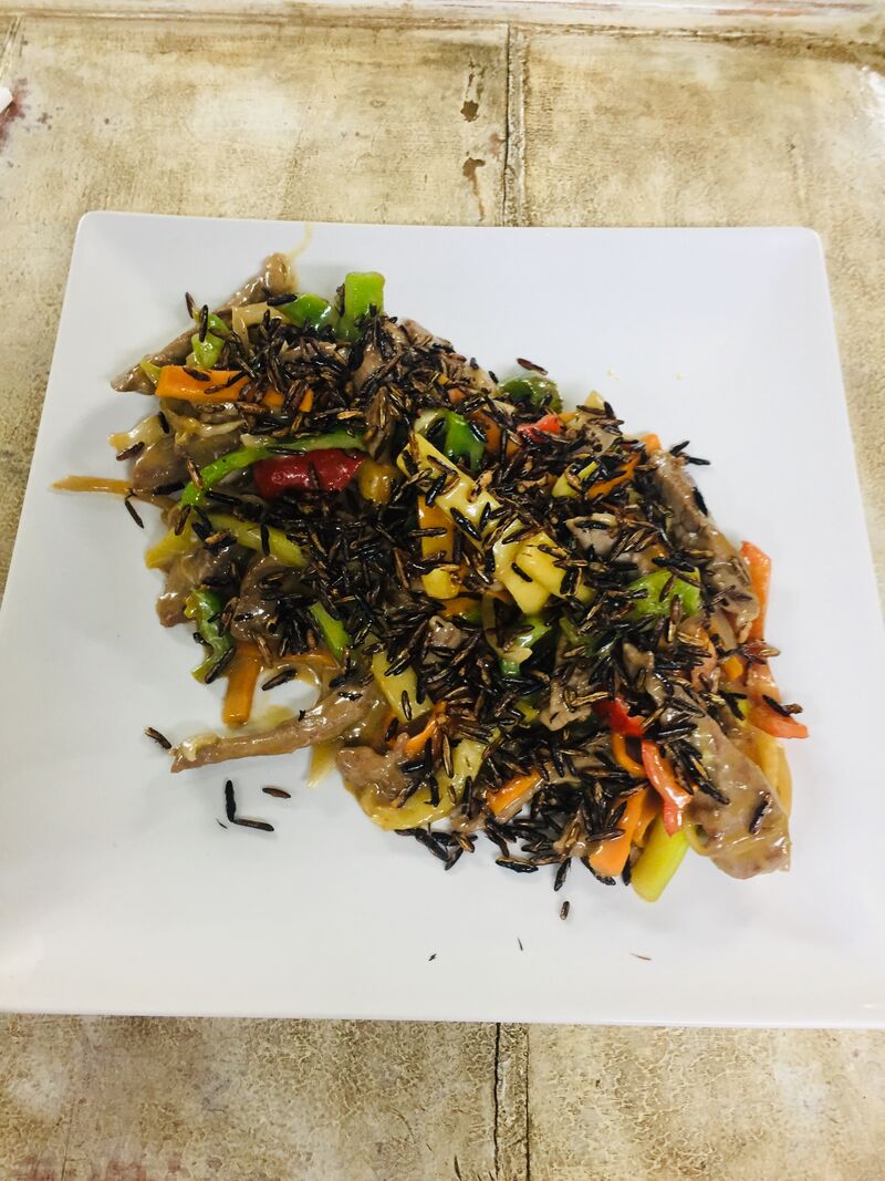 Wok de presa con verduras leche ee coco y arroz salvaje