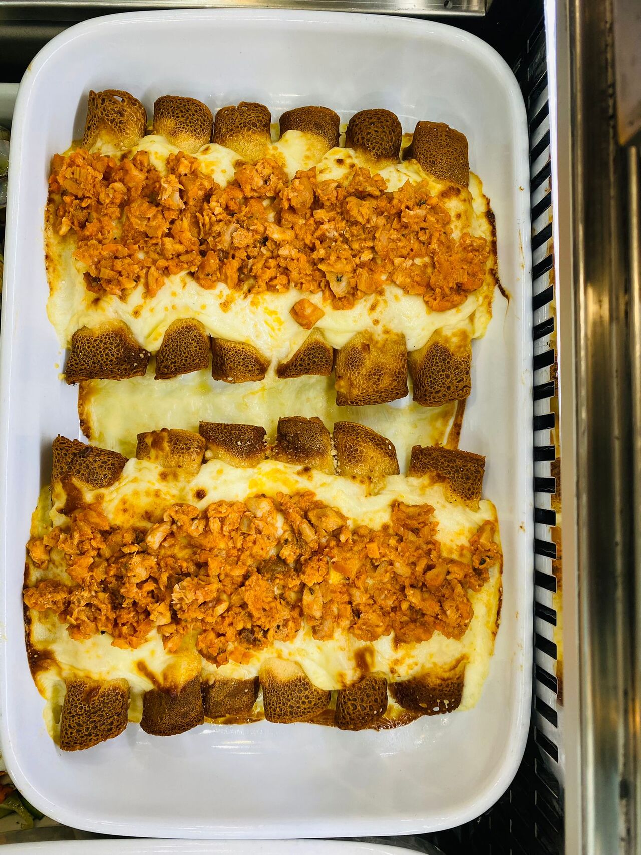 Cannelloni di baccalà mantecato con ragù di mare