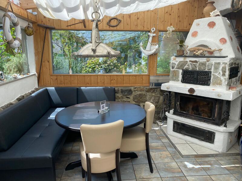 Wintergarten mit Kamin