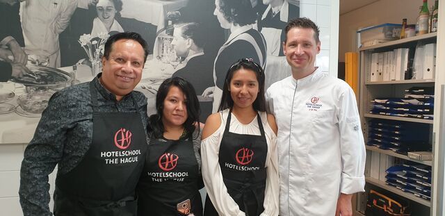 City of the world event 2 girls from the peruvian cook school en Pachacutec Lima Peru, here with Chef Joost de Vos 