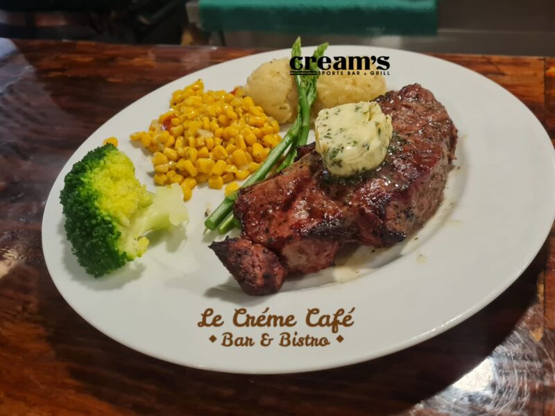  NEW YORK TRIP STEAK TOPPED W/GARLIC HERBS BUTTER