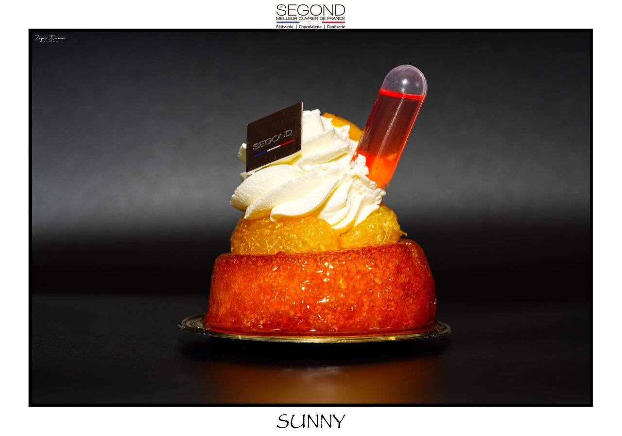 Sunny / Baba imbibé au jus d orange et passoa, segments d'oranger chantilly fruits de la passion.