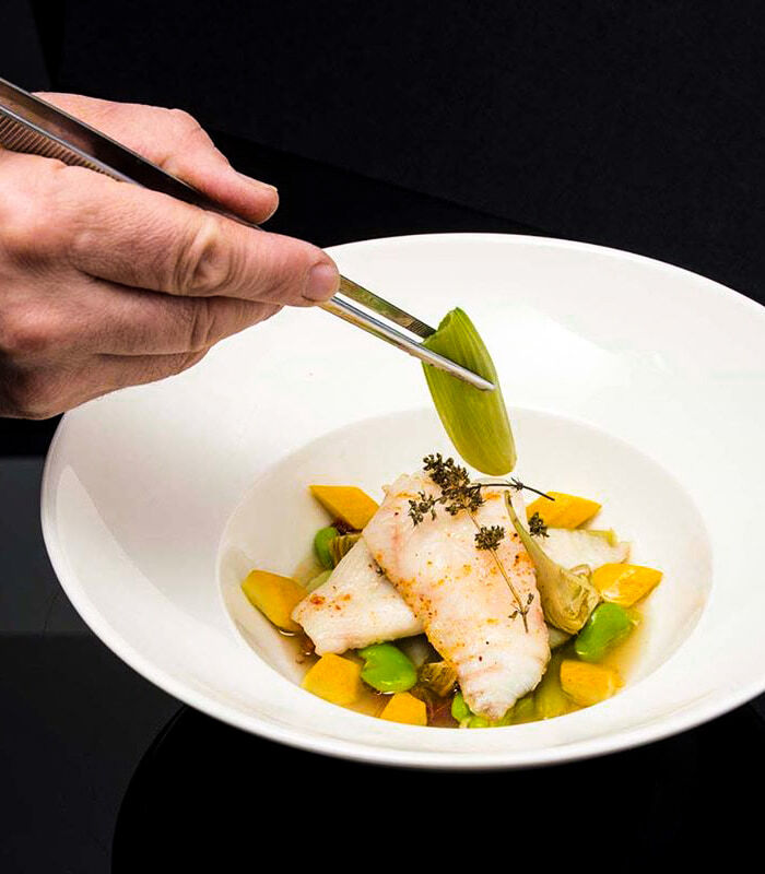 Filet de saint pierre braisé en minestrone et coquillages 