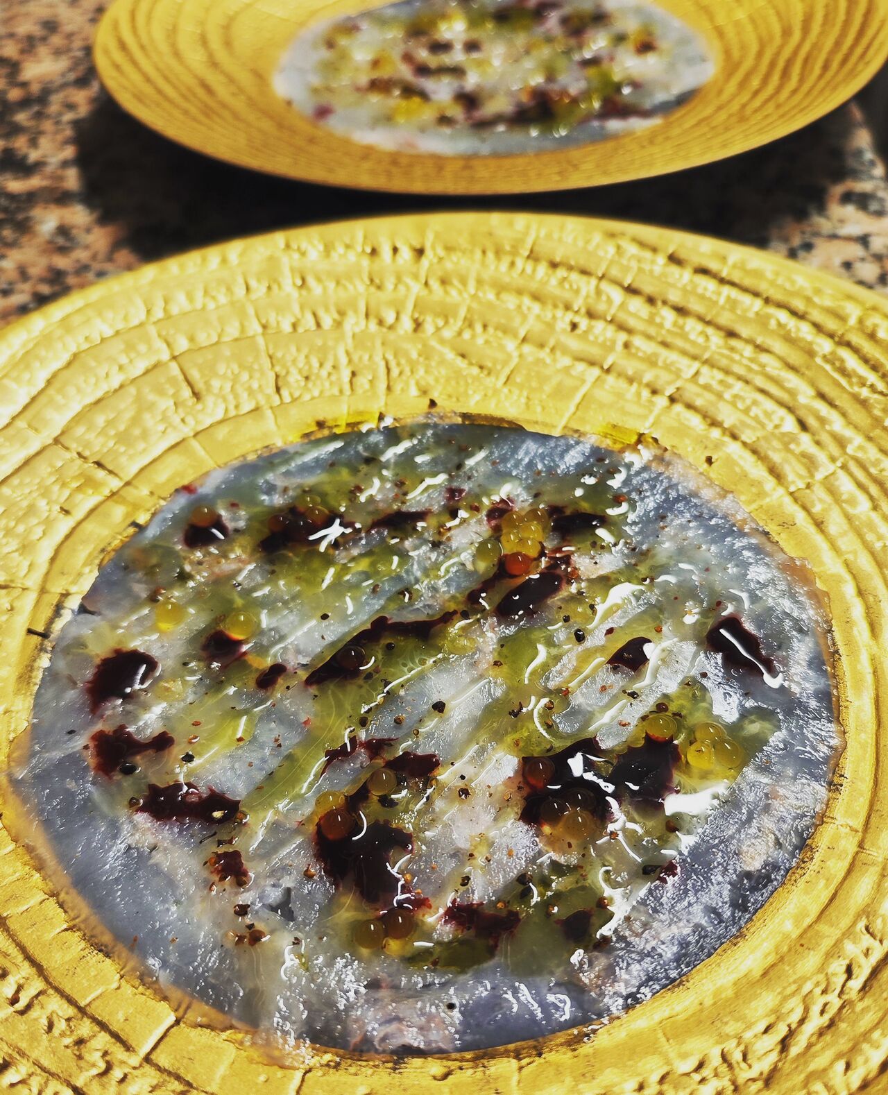 Carpaccio de langoustines, vinaigrette a la manque