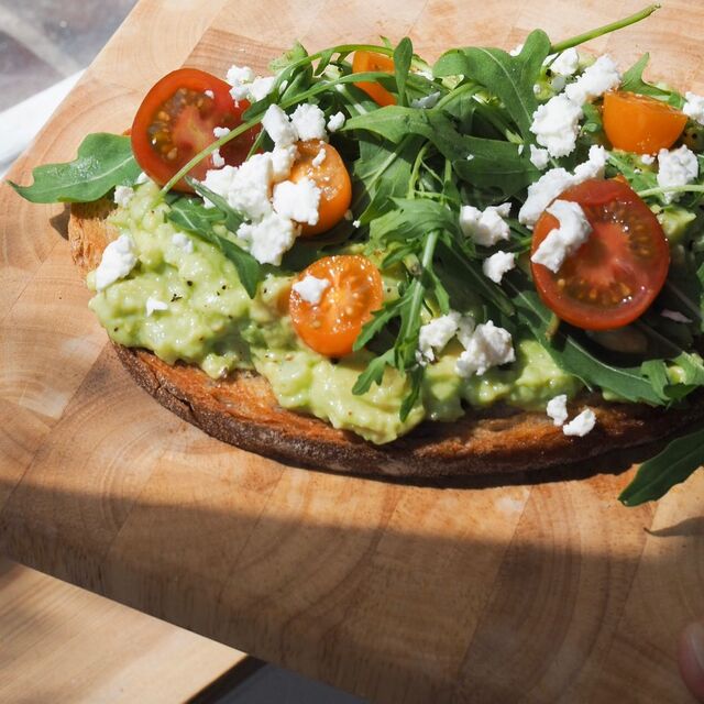 Smashed avocado toast with feta and cherry tomatoes