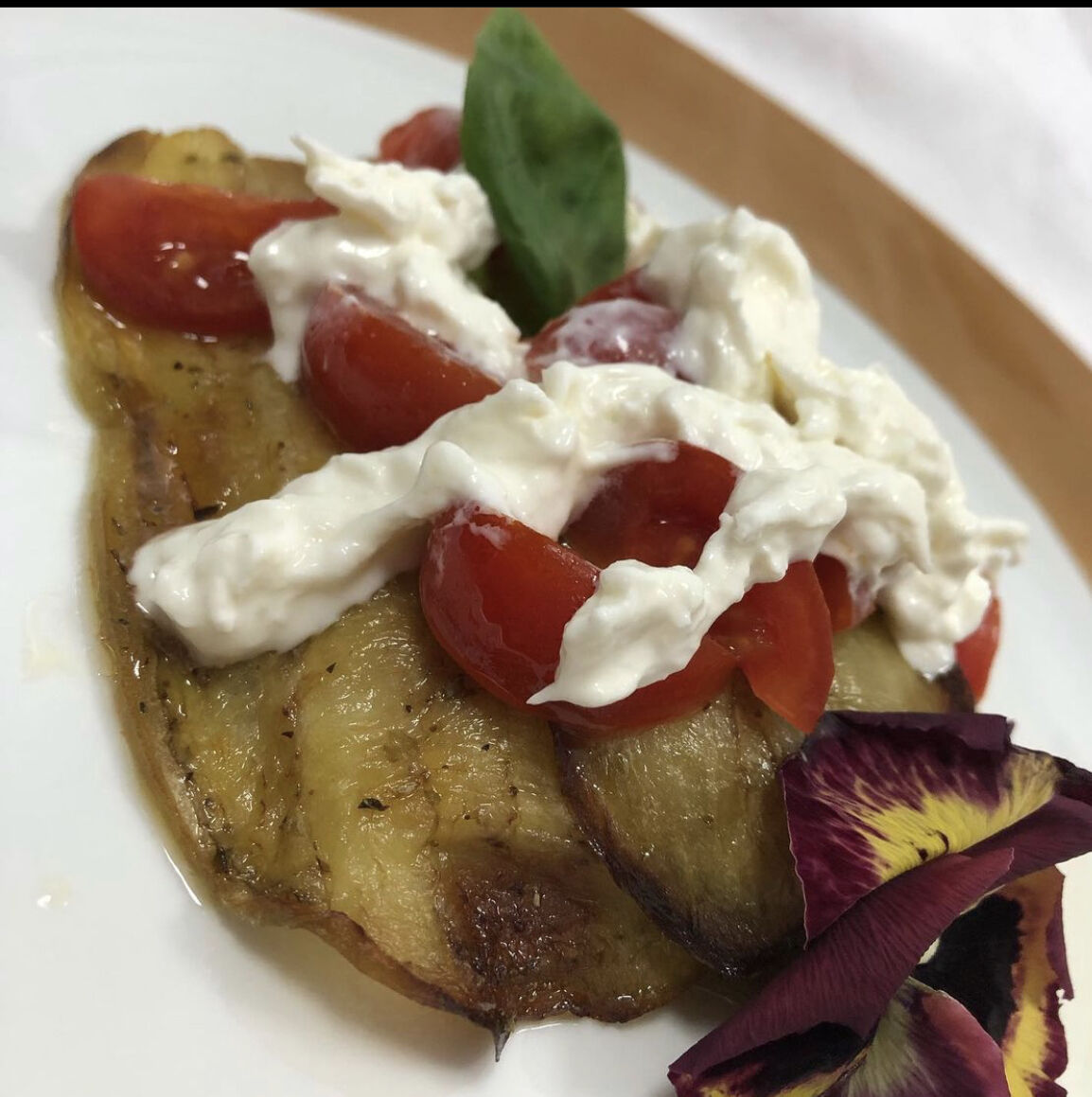 filetto di Persico in gabbia di melanzane pomodorini e burrata