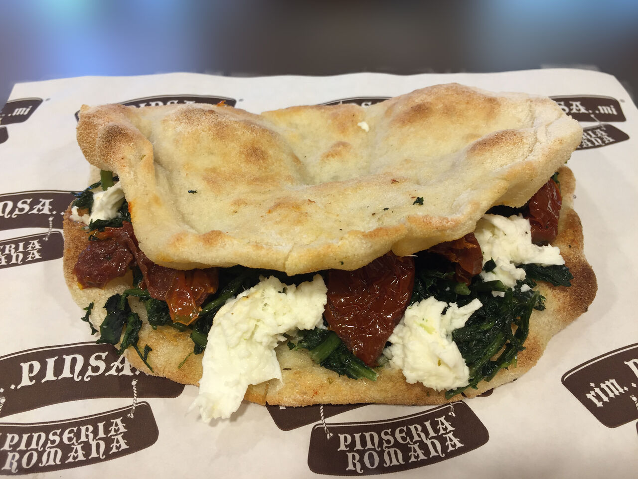 Pinsotto cicoria ripassata bufala e pomodori secchi