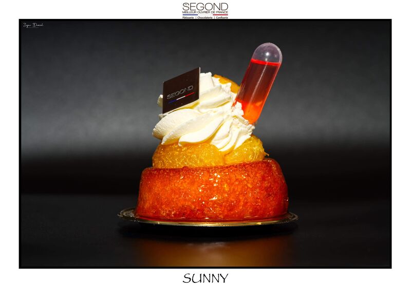 Sunny / Baba imbibé au jus d orange et passoa, segments d'oranger chantilly fruits de la passion.