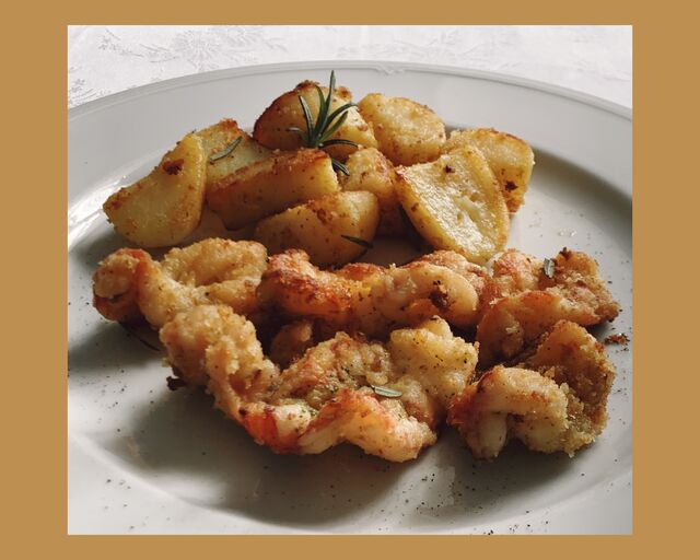 Code di gambero argentino con pane aromatizzato e rosmarino fresco.