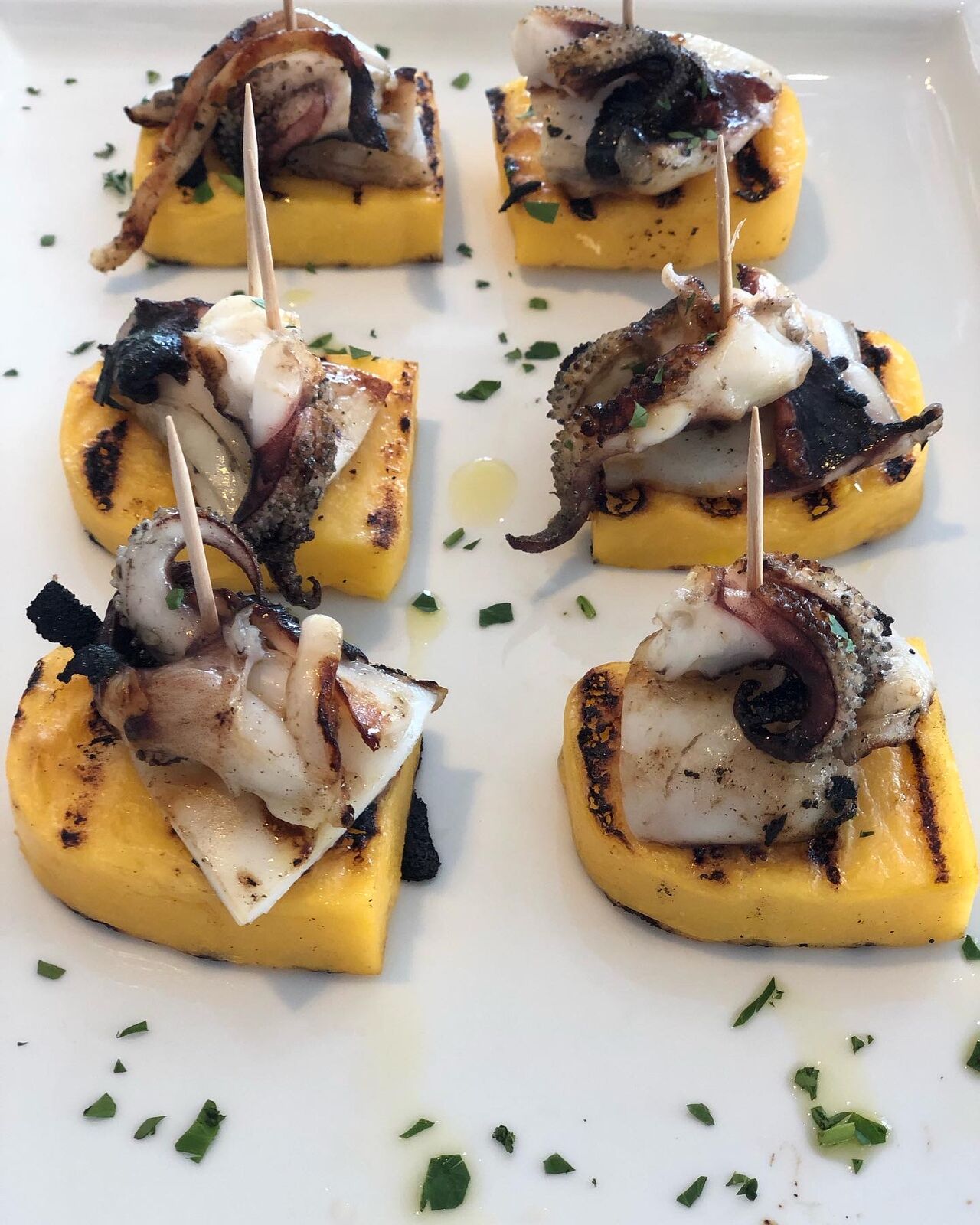 Seppie Arroste con polenta gialla.