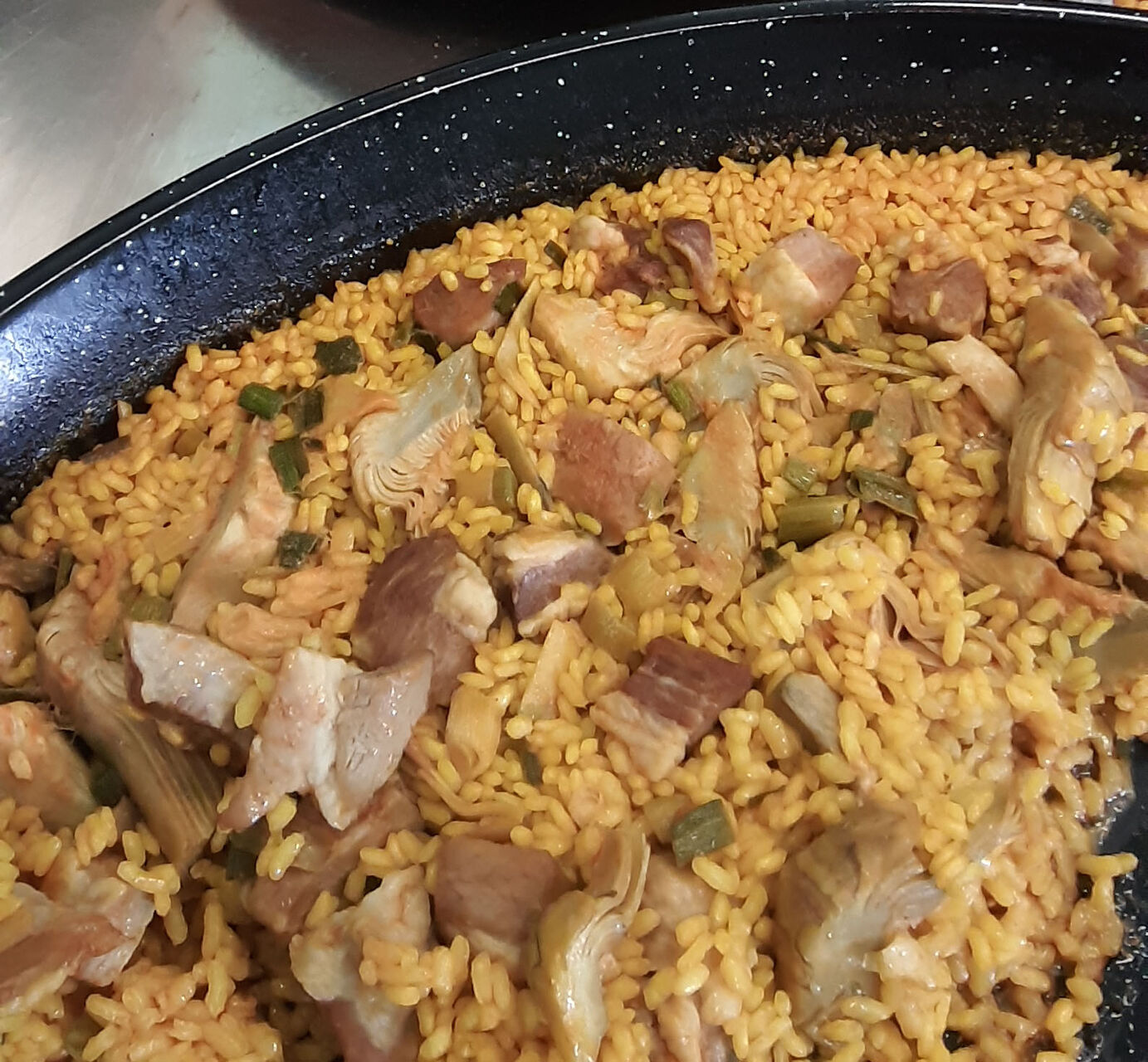 Paella de secreto de cerdo