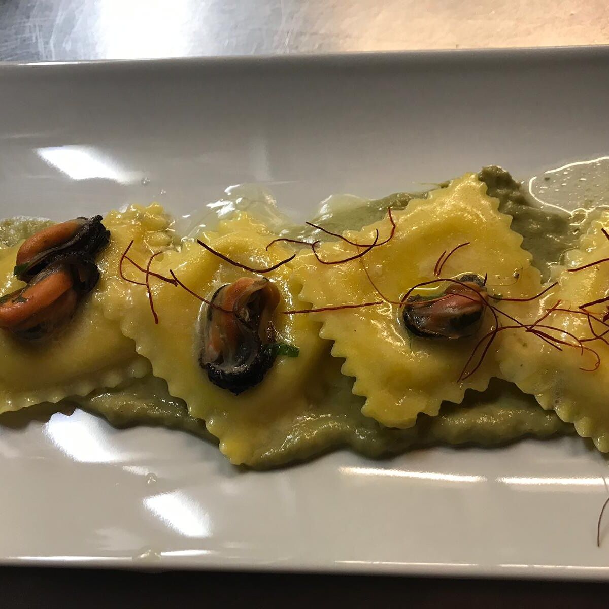 Ravioli cacio e pepe ai frutti di mare